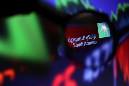 Saudi Aramco net profit drops broadly as expected, shares inch up