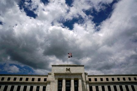Fed looks to slice balance sheet runoff pace by half